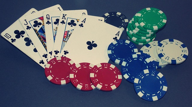 A photo of playing cards and casino chips on a table.
